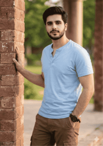 A modern stylish young boy standing in a natural outdoor environment wearing a casual outfit, with soft natural lighting and a cinematic portrait style.
